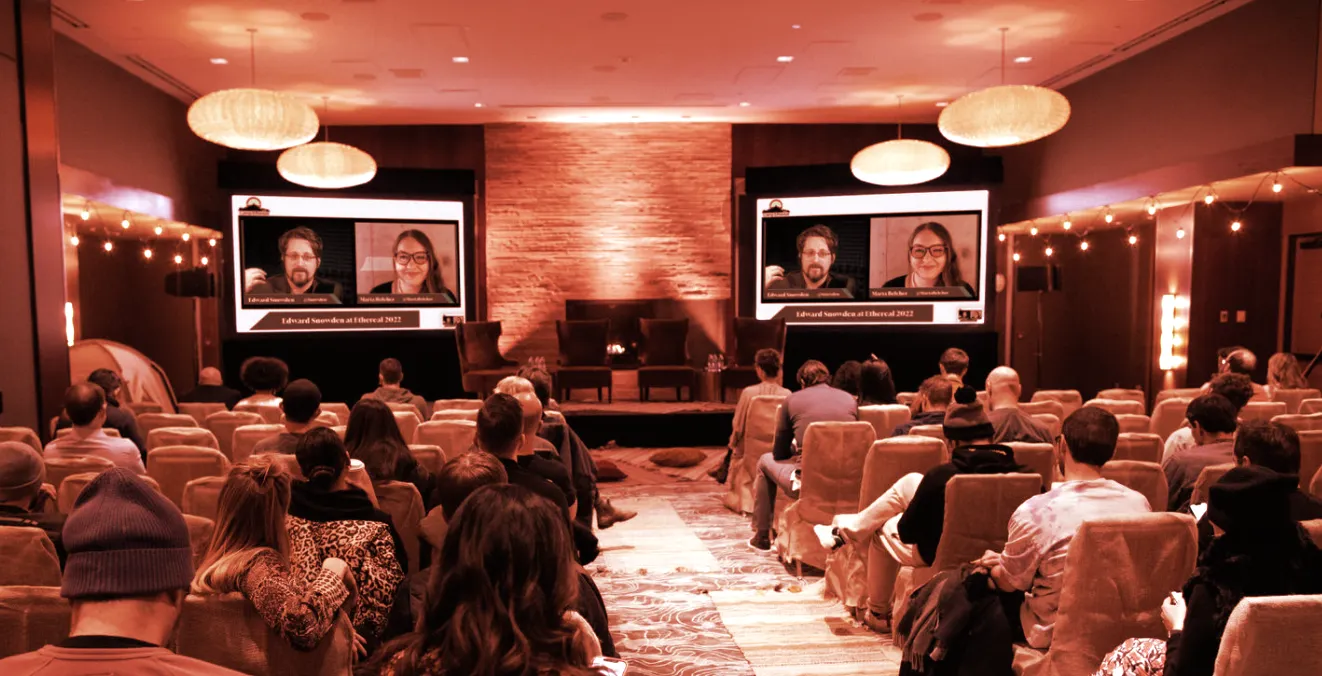 Edward Snowden's interview with Marta Belcher playing on screens at Camp Ethereal 2022. (Photograph by Chie Endo)
