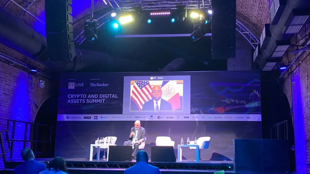 A conference stage in purple light. 