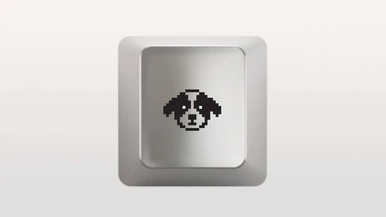 A silver keyboard key with pixel art depicting a dog.