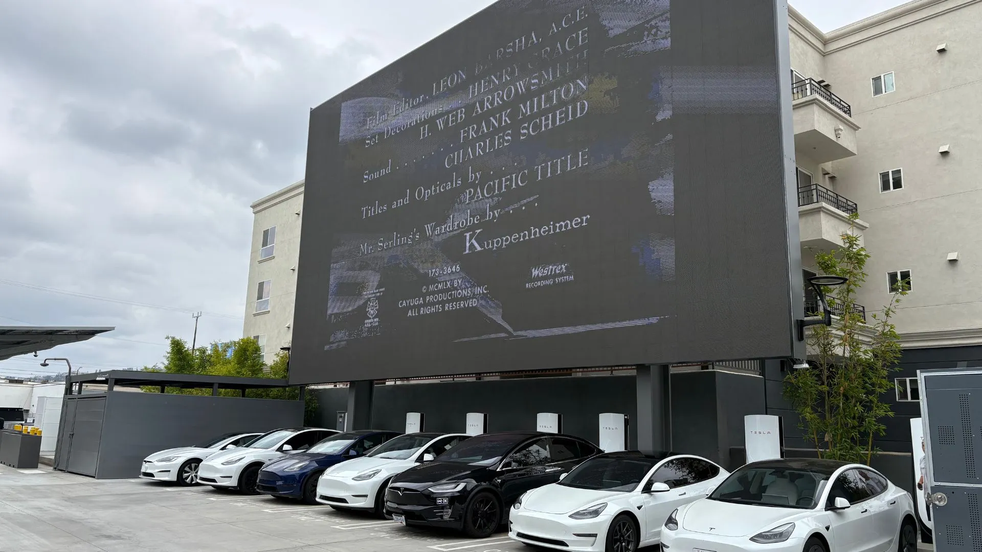 Tesla cars beneath an LED screen. Image: Jason Nelson/Decrypt